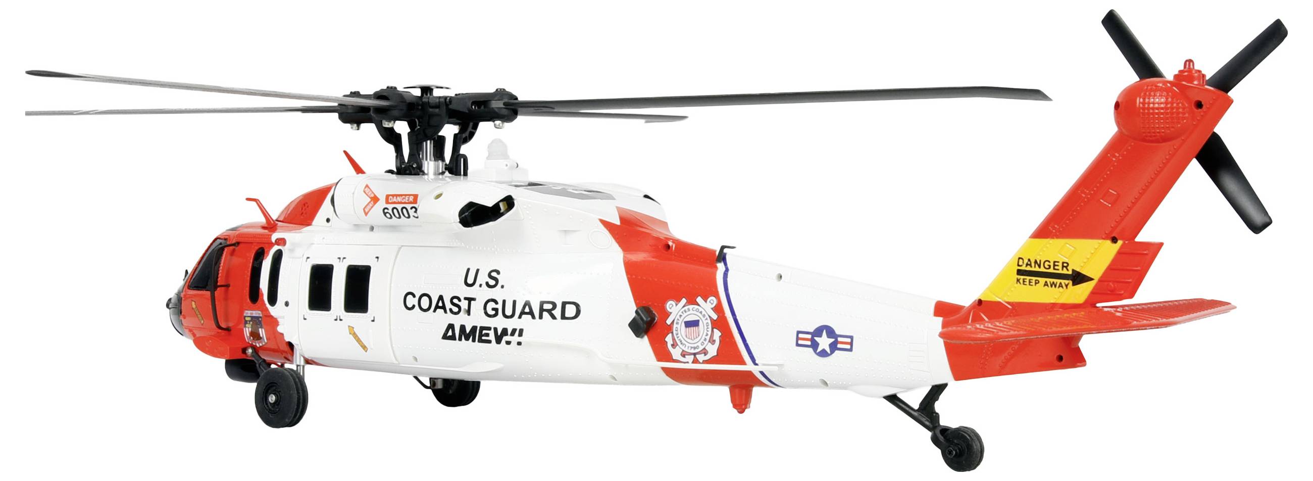 Ein Hubschrauber der U.S. Coast Guard mit rot-weißen Markierungen, der sich in mittlerer Flughöhe schwebt.