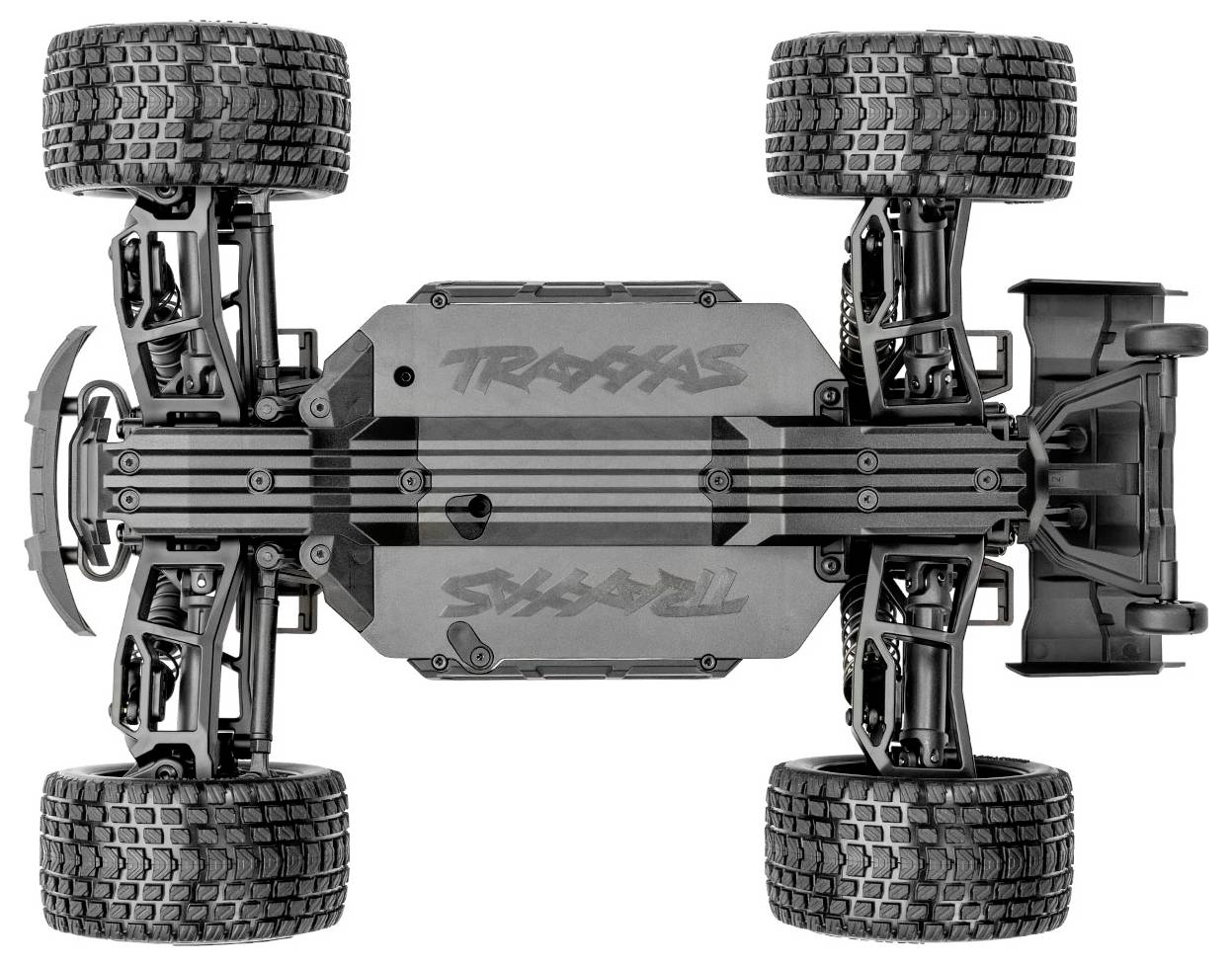 Unterseite eines schwarzen RC-Trucks (Fernsteuerwagens) mit großen, strukturierten Reifen, die Federungs- und Antriebskomponenten zeigt.
