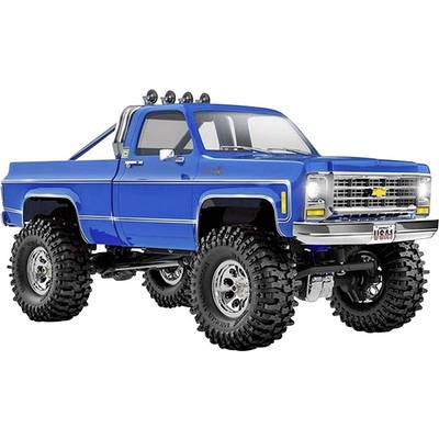 Ein blauer Geländewagen mit großen Reifen und Chromdetails, der ein Vintage-Design aufweist, wird im Profil auf einem weißen Hintergrund dargestellt.
