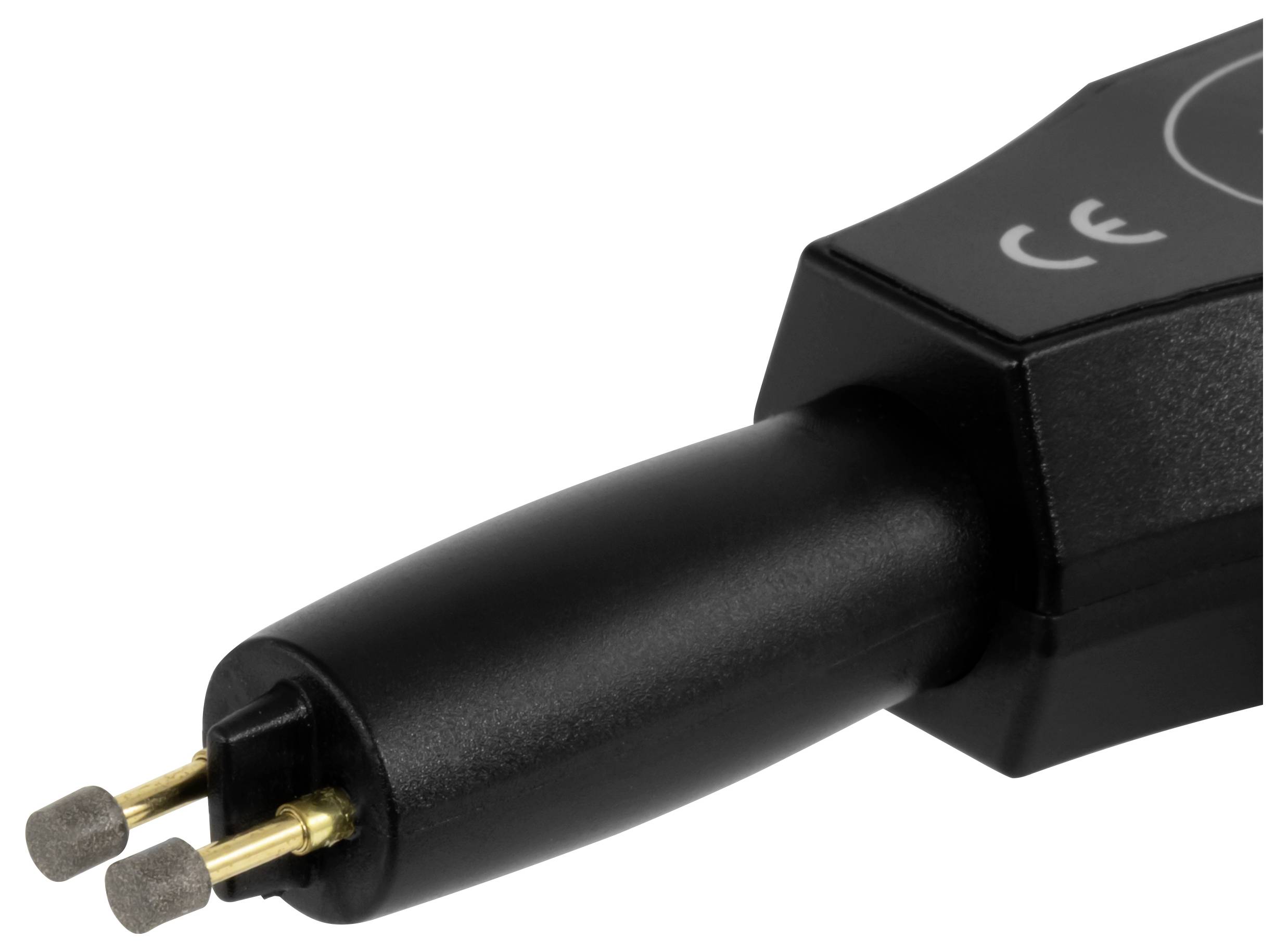 Nahaufnahme eines schwarzen tragbaren Geräts mit zwei goldenen Sonden, wahrscheinlich ein medizinisches oder Testgerät, auf weißem Hintergrund.