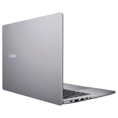 Ein silberner Laptop, teilweise geöffnet, zeigt Tastatur und Anschlussanschlüsse, mit der Aufschrift "Elite Experience" auf dem Deckel.