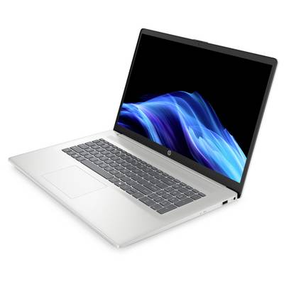 Ein silberner Laptop mit einer beleuchteten Tastatur und einem lebendigen, blauen abstrakten Design auf dem Bildschirm, von einem Seitenwinkel aus gezeigt.
