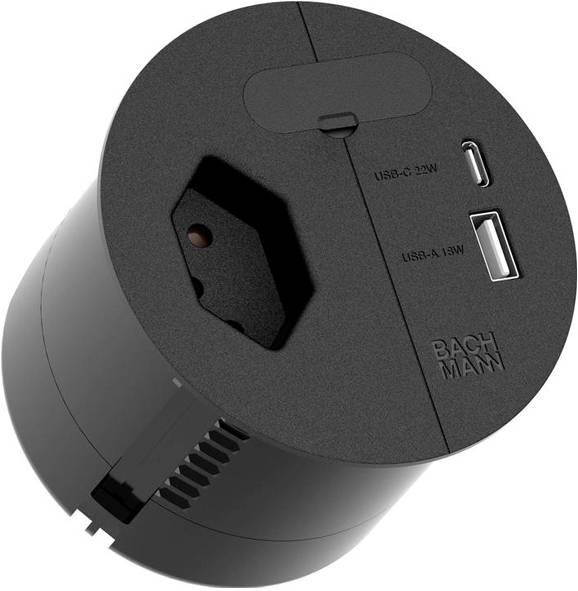 Ein schwarzes kreisförmiges Stromversorgungsmodul mit einem USB-C-Anschluss, einem USB-A-Anschluss und einer Standard-Steckdose.