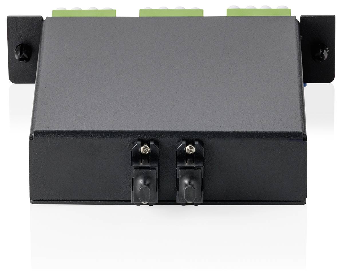 Ein schwarzes rechteckiges elektronisches Gerät mit Anschlüssen oben und zwei Anschlüssen an der Vorderseite, montiert auf einer ebenen Fläche.