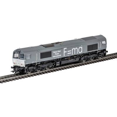 Eine graue Lokomotive mit der Aufschrift „Heavy Haul Power International" und „F=ma" fährt auf Eisenbahnschienen und unterstreicht dabei leistungsstarken Transport.