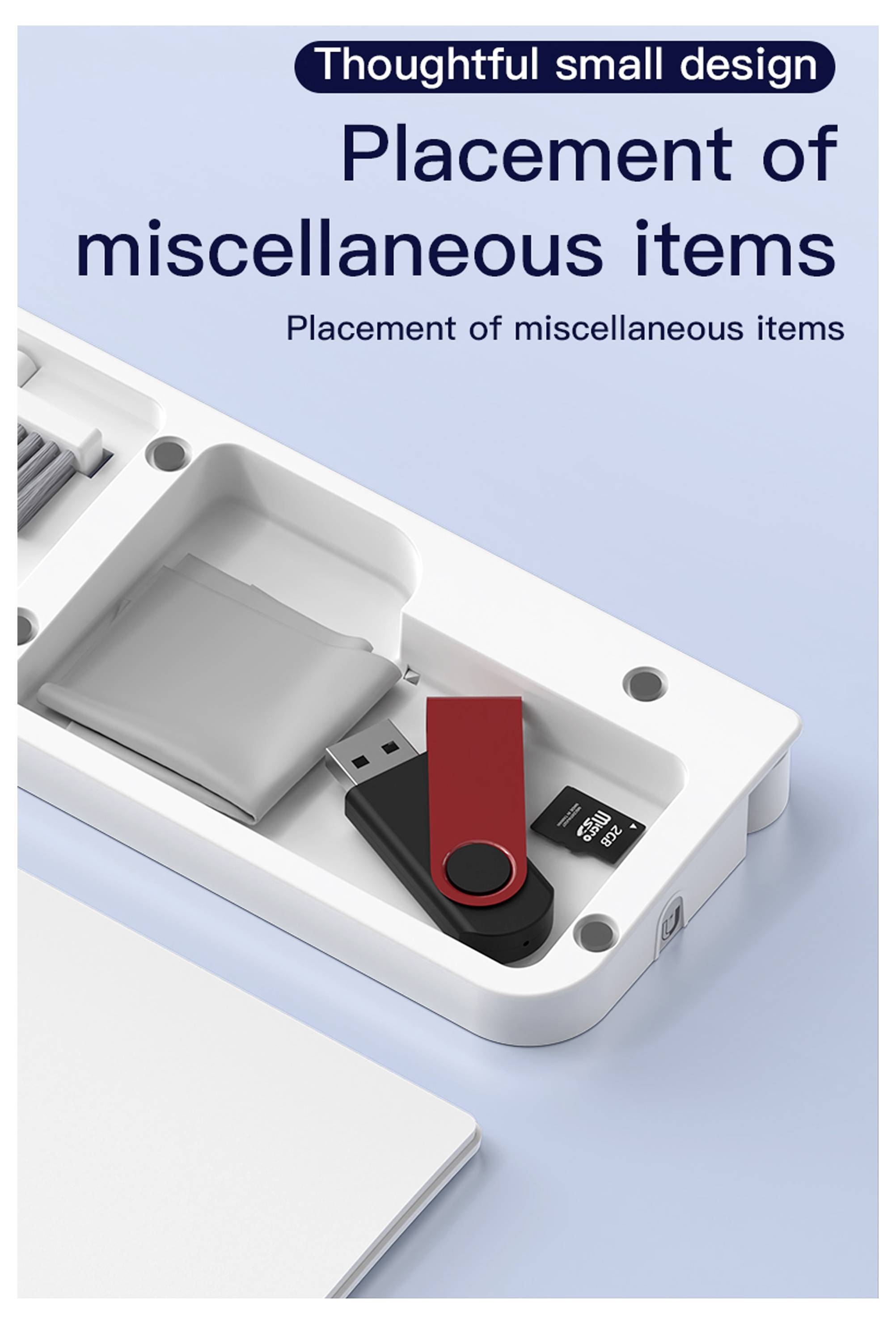 „Anordnung verschiedener Gegenstände" Text über einem organisierten Schreibtisch-Zubehörfach, das ein USB-Laufwerk und kleine Fächer enthält.