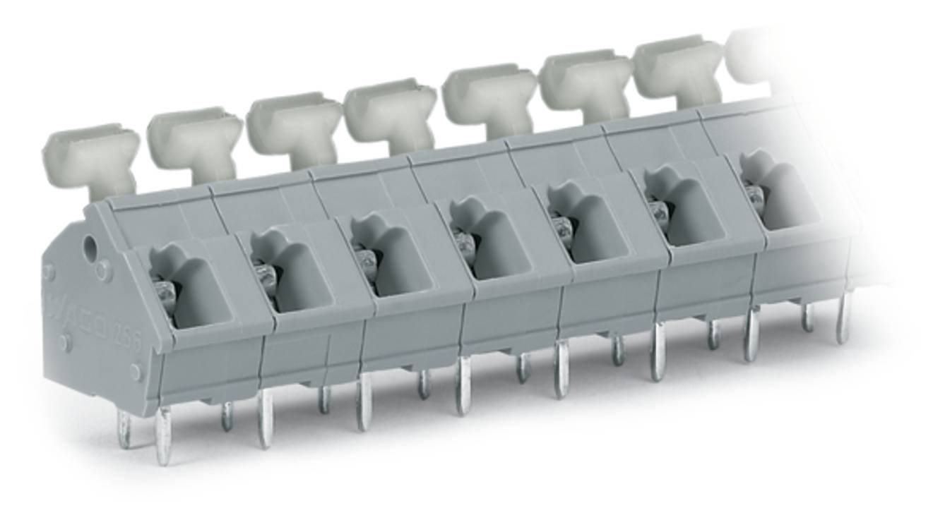 Eine Reihe grauer elektrischer Anschlussleisten mit Metallstiften und weißen Hebelschiebern, ausgelegt für Elektroinstallation und Verbindung.