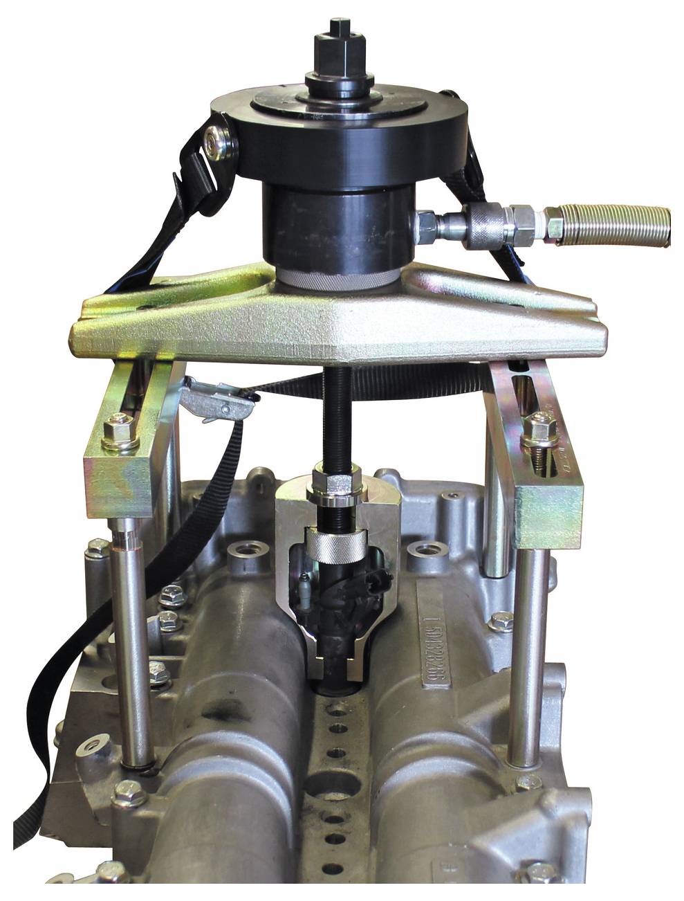 Ein Ventilfedern-Kompressor-Werkzeug, das an einem Automotor befestigt ist und mechanische Teile zum Entfernen oder Einbauen von Ventilfedern zeigt.