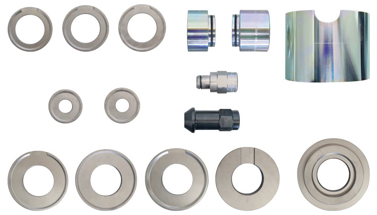 "Metal-Konstruktions-Hardware-Set" mit runden und zylindrischen Metallkomponenten, wahrscheinlich für Montage- oder Reparaturzwecke.