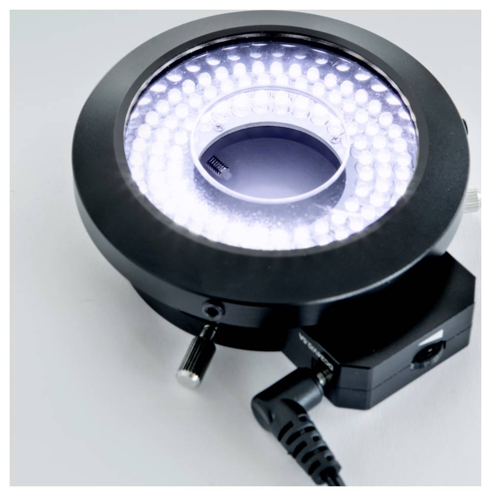 Ein digitales Monitor zeigt das Logo „KERN OPTICS". Darunter zeigen drei kreisförmige Bilder eine Biene, blaue Zellen und elektronische Komponenten.