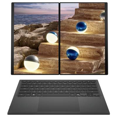Ein eleganter Laptop mit geteiltem Bildschirm, auf der einen Seite eine felsige Küstenlandschaft und auf der anderen Seite leuchtende Kugeln auf einer Treppe.