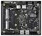 Ein kompaktes Computer-Motherboard mit USB-Anschlüssen, RAM-Steckplätzen mit der Bezeichnung "12V DDR4" und verschiedenen Konnektoren, untergebracht in einem kleinen, quadratischen Gehäuse.