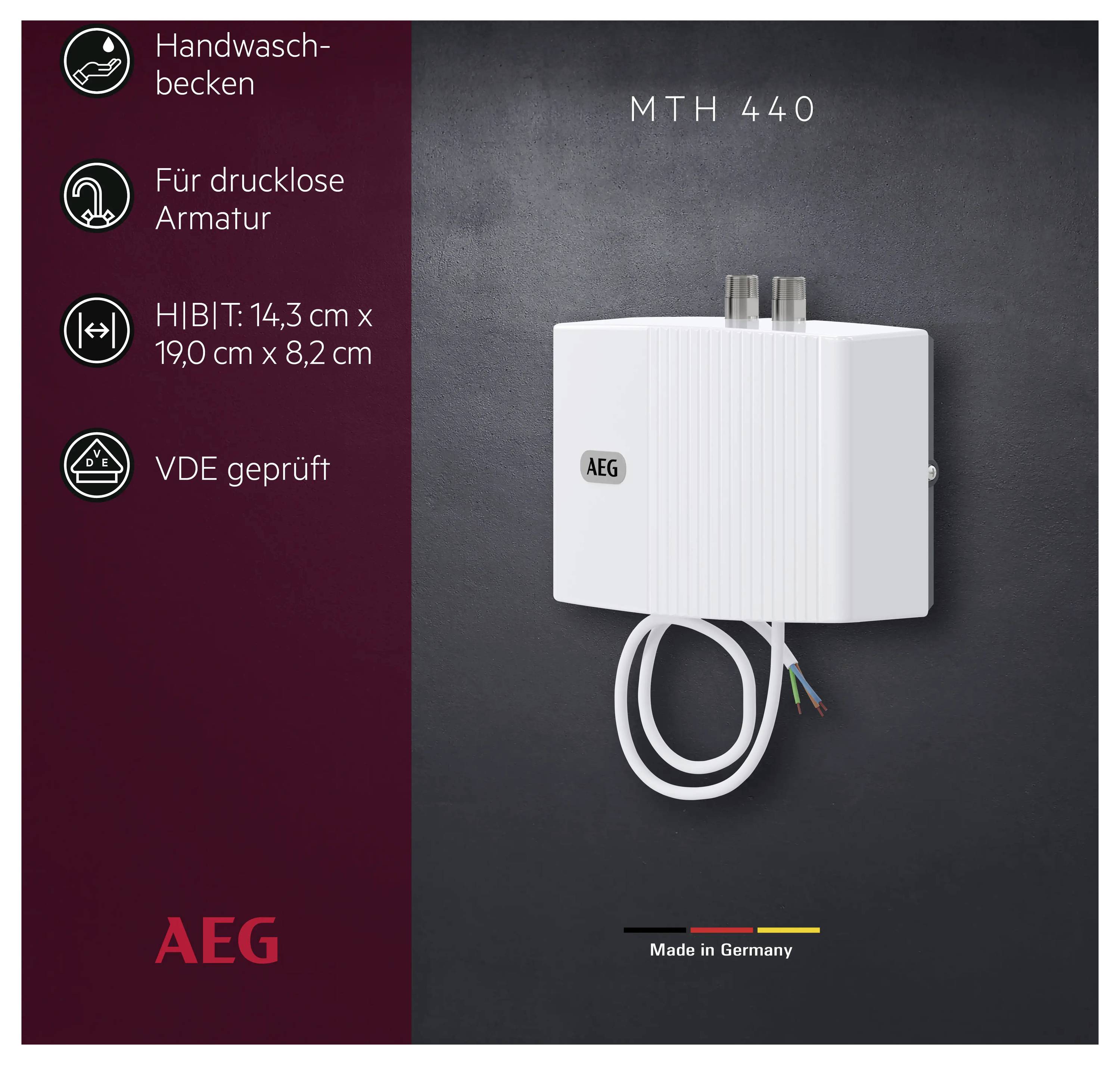 'AEG MTH 440', Warmwasserbereiter in Weiß, gekennzeichnet als 'Made in Germany'. Die Merkmale umfassen 'VDE geprüft', 'Für drucklose Armatur' und 'Handwaschbecken', Abmessungen 14,3 cm x 19,0 cm x 8,2 cm.