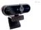 Eine schwarze und verchromte Webcam mit den Logos „1080P" und „i-tec" auf der Vorderseite, auf einem verstellbaren Ständer montiert, geeignet für Videokonferenzen.