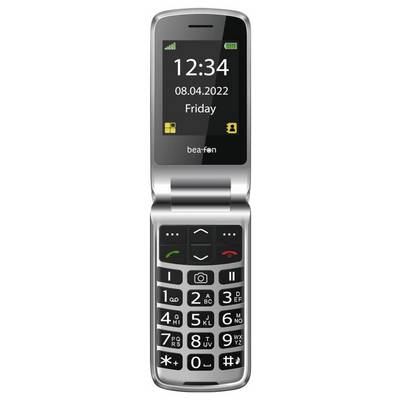 Ein silbernes Klapphandy mit großem Bildschirm, auf dem „12:34, 08.04.2022, Freitag" angezeigt wird. Unter dem Bildschirm ist eine Tastatur mit großen Tasten sichtbar.