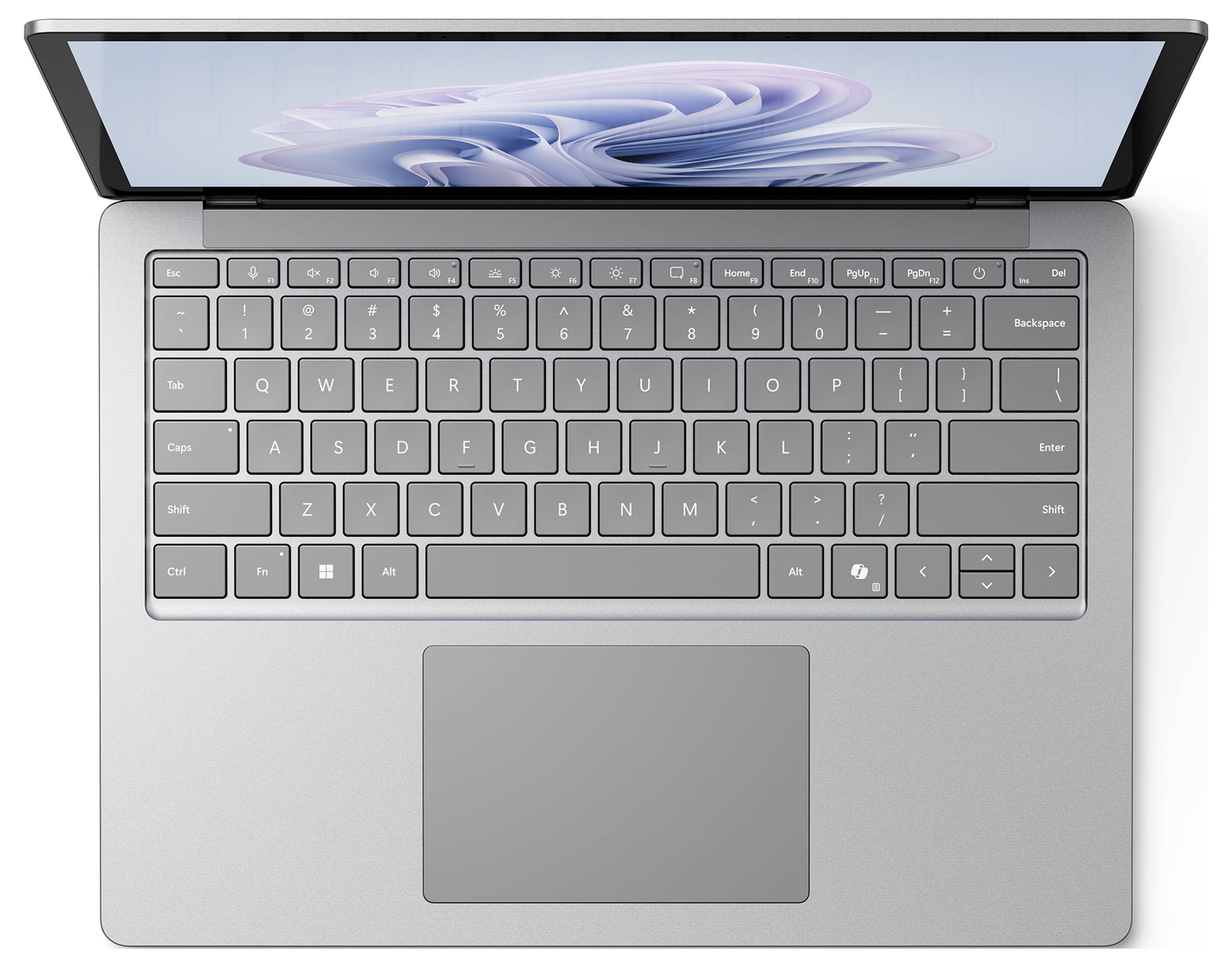 Ein silberner Laptop von oben betrachtet mit sichtbarer Tastatur und schwarzem Bildschirm, auf dem ein abstraktes blau-weißes Design angezeigt wird.