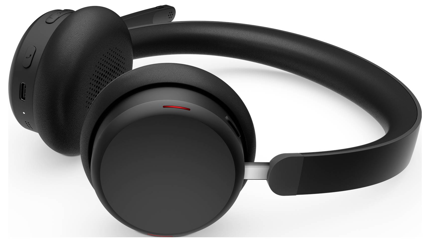 Ein schwarzes kabelloses Headset mit gepolstertem Kopfbügel und rotem Licht auf einer Ohrmuschel, das ein Merkmal anzeigt und für die Kommunikation konzipiert ist.