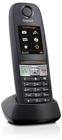 Ein schnurloses Telefon mit einem digitalen Display, das Menüoptionen anzeigt, und einer numerischen Tastatur befindet sich auf seiner Ladestation.