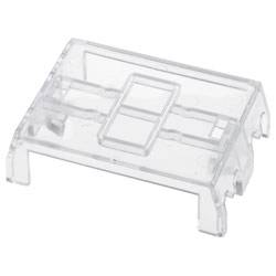 Ein durchsichtiger Kunststoff-Tastenkappenklemmer für eine Tastatur, dargestellt in einer geneigten Ansicht.