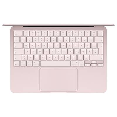 Ein rosa Laptop von oben betrachtet, mit kompaktem Tastaturlayout und einem großen Trackpad darunter.