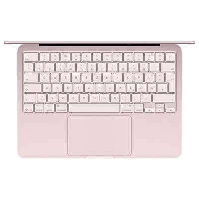 Eine rosegoldene Laptop-Tastatur wird von oben gezeigt und verfügt über ein Trackpad darunter sowie ein deutsches QWERTZ-Layout.