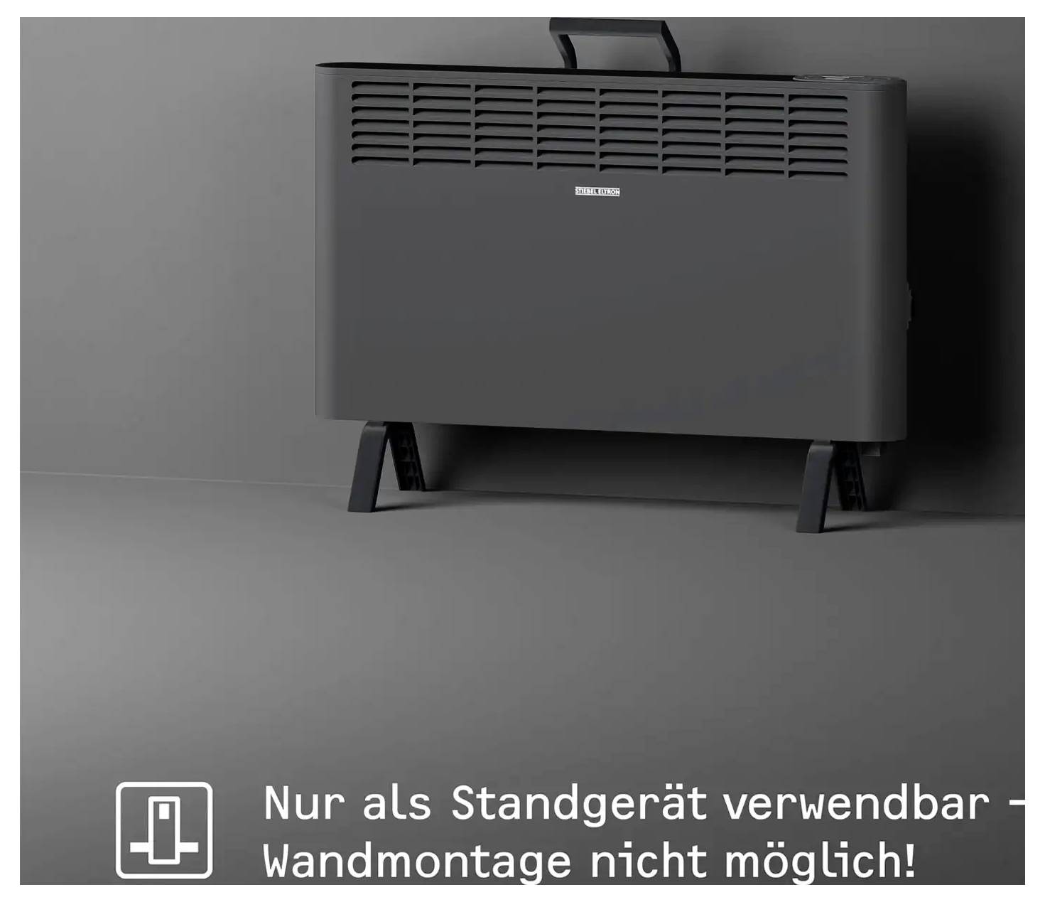 Eine schwarze Heizeinheit auf einem grauen Boden, positioniert gegen eine graue Wand, mit Text in deutscher Sprache, der anzeigt, dass sie nur als freistehendes Gerät geeignet ist und nicht zur Wandmontage.