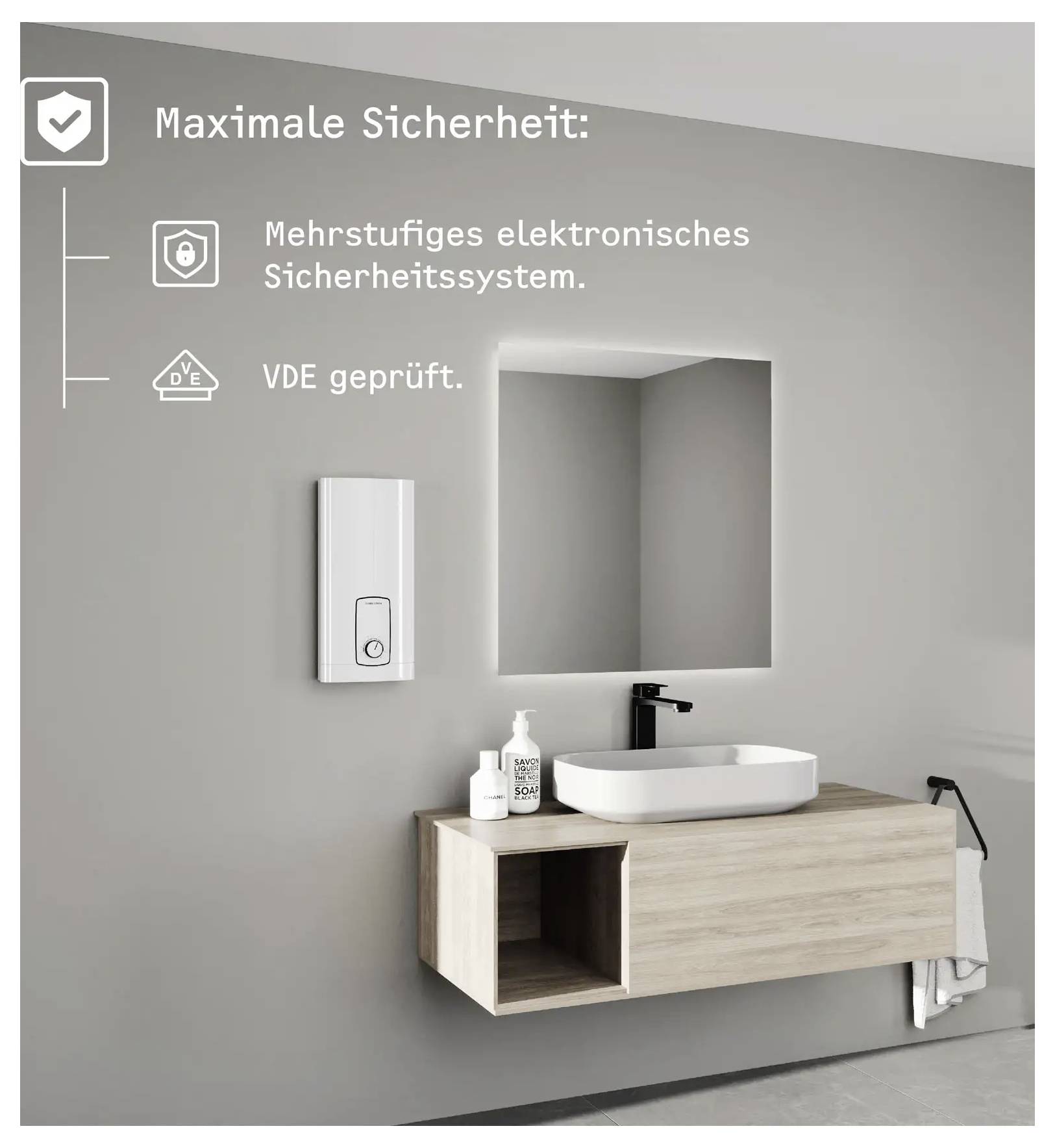 Badezimmerinnenraum mit modernem Waschbecken und Armatur. Wandtext lautet „Maximale Sicherheit: Mehrstufiges elektronisches Sicherheitssystem. VDE geprüft."