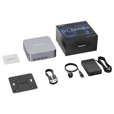 Geekcom GT Series Mini-PC-Set mit dem kompakten Computer, Markenschachtel, Montageplatte, Netzteil, Stromkabel und HDMI-/USB-Zubehör.