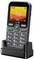 Ein Mobiltelefon mit einer Tastatur und farbigem Display, das die Uhrzeit „16:10" und das Datum „15/09/2024" anzeigt, auf einer Ladestation platziert.