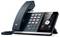 Ein schwarzes Schreibtischtelefon mit digitalem Display zeigt Anrufoptionen zum "Ablehnen" oder "Annehmen" mit den Ziffern 1-9, einem Lautsprecher und einem HD-Logo.