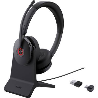 Kabelloses Headset auf Ladeständer mit USB-Dongle und Adapter.