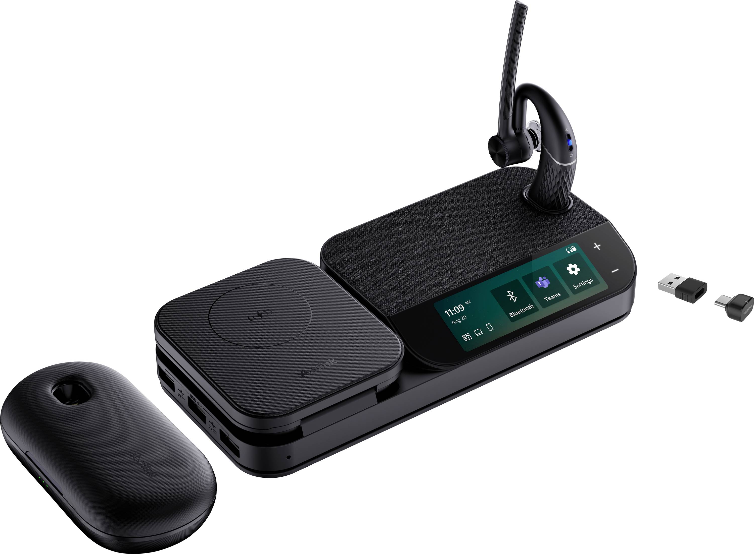 Eine schwarze kabellose Ladestation mit Touchbedienungen und Display, ein abnehmbares Headset auf einem Ständer und dazugehöriges Zubehör.