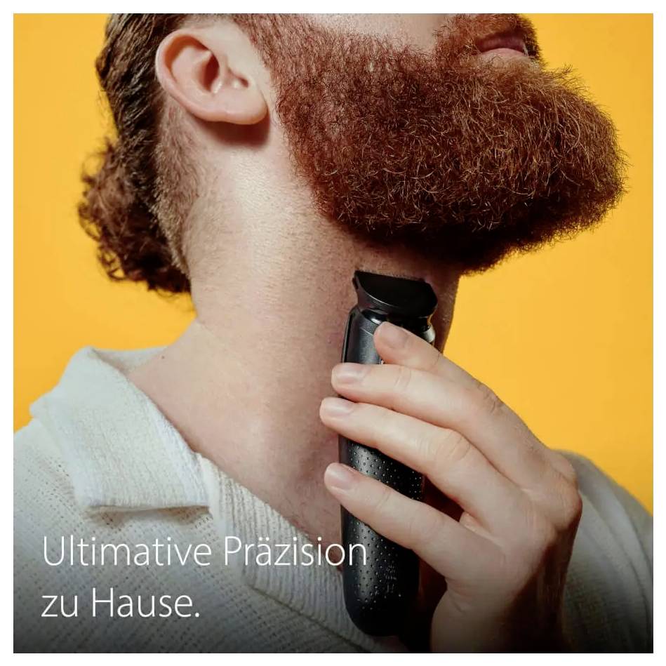 Eine Person trimmt ihren Bart mit einem elektrischen Trimmer und zeigt damit die Heimrasur. Der Text lautet „Ultimative Präzision zu Hause."