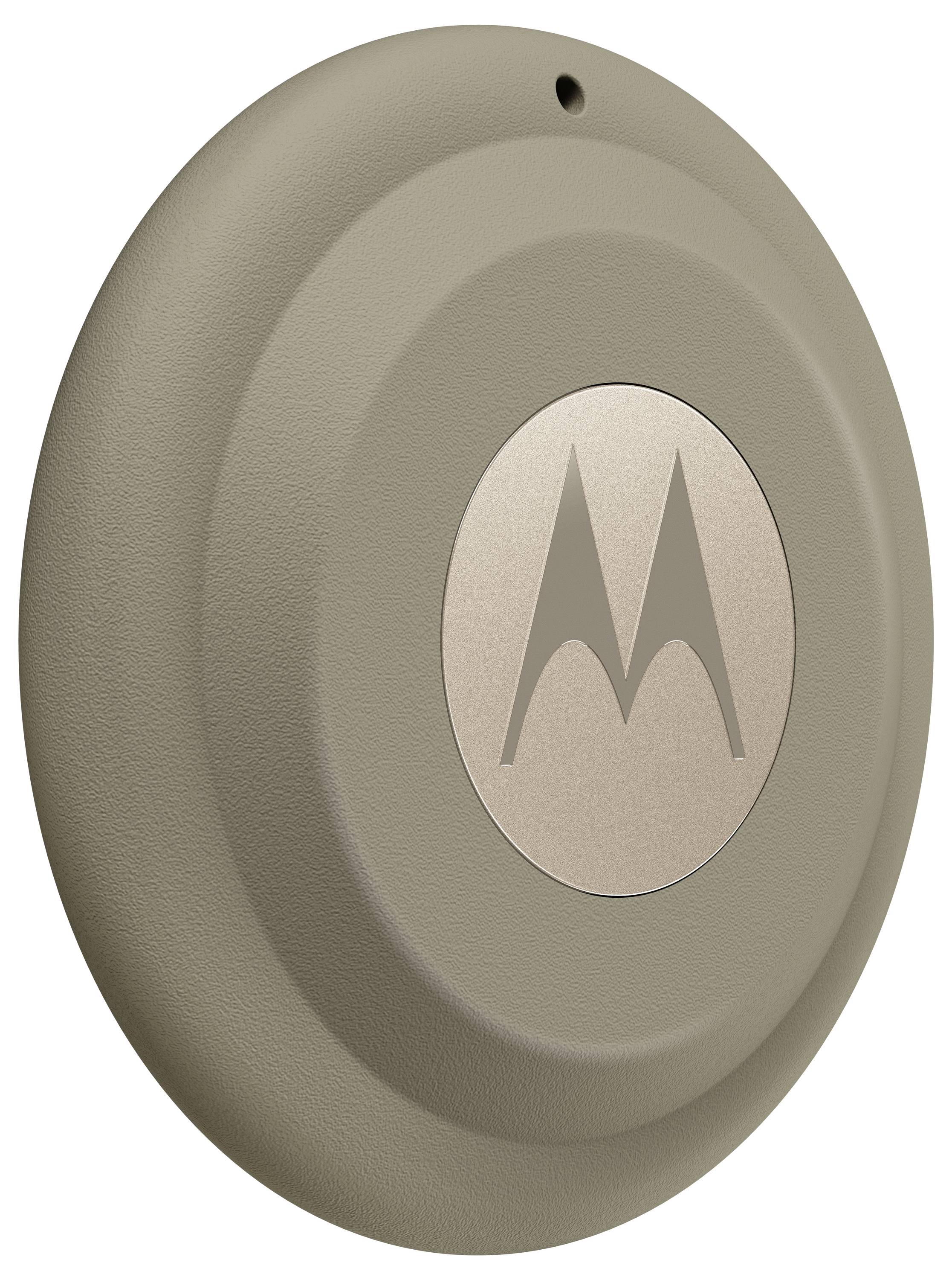 Ein rundes, braunes Motorola-Logo auf einer strukturierten Oberfläche.