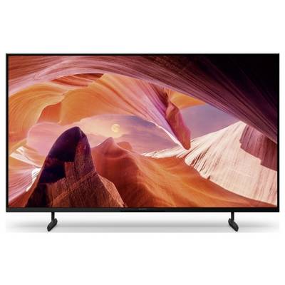 Ein Flachbildfernseher zeigt eine lebendige abstrakte Canyon- oder Sandsteinlandschaft mit warmen orange- und rosafarbenen Felsformationen und einem hellen sonnenähnlichen Glühen.