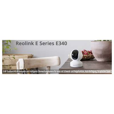 Reolink E Series E340: Kompakte WLAN-Überwachungskamera mit Schwenk- und Neigefunktion, 8 MP, 3x optischer Zoom, auf Tisch platziert.