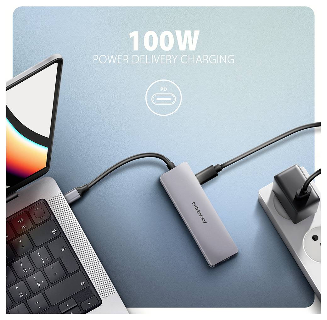 Promotionalbild eines Laptops, der mit einem schlanken KAKO-Stromlieferungsadapter verbunden ist, mit dem Text „100W POWER DELIVERY CHARGING" auf blauem Hintergrund.