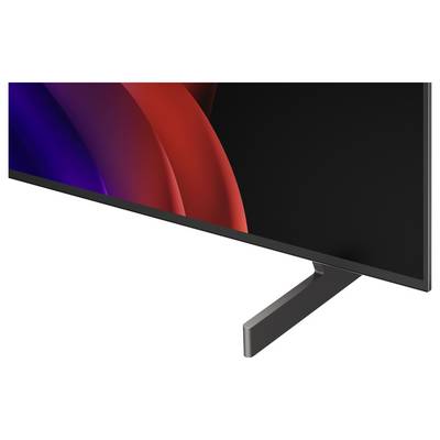 Nahaufnahme eines Flachbildfernsehers mit schwarzem Rahmen und Ständer, auf dessen dunklem Bildschirm abstrakte rote und blaue gekrümmte Lichter angezeigt werden.