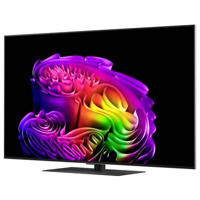 Ein moderner Flachbildfernseher zeigt ein farbenfrohes abstraktes Regenbogen-Muster auf schwarzem Hintergrund, schräg auf einem Ständer angebracht dargestellt.