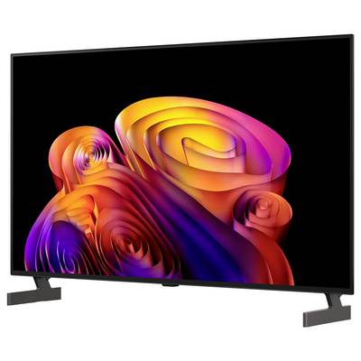 Flacher Fernseher mit buntem abstraktem Wirbel-Hintergrundbild auf schwarzem Bildschirm, auf einem Ständer vor weißem Hintergrund dargestellt.