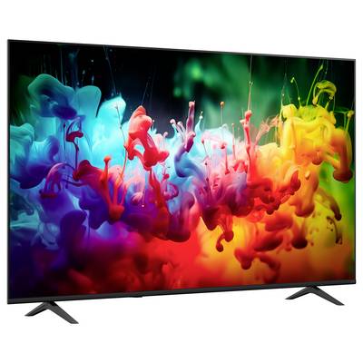Flachbild-Fernseher mit einem farbenfrohen abstrakten Spritzfarben-Bild auf schwarzem Bildschirm, dünnem Rahmen und Standfuß.