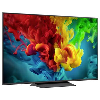 Flachbildfernseher zeigt lebendige abstrakte Wirbel aus roten, gelben, grünen und blauen rauchartigen Farben auf dunklem Hintergrund.