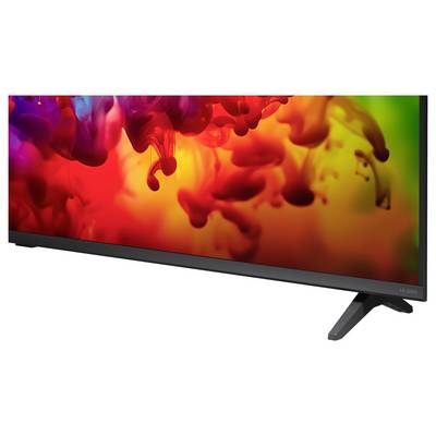 Flachbildschirm-Monitor auf weißem Hintergrund, auf dem bunte rote, orange, gelbe und violette abstrakte Tintenwirbel angezeigt werden.