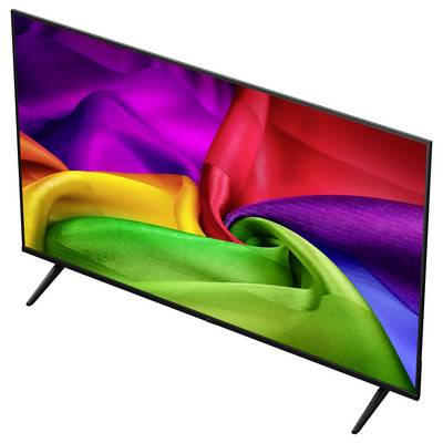 Flachbildfernseher auf Ständer, der leuchtende regenbogenfarbene abstrakte Wirbel auf weißem Hintergrund anzeigt.