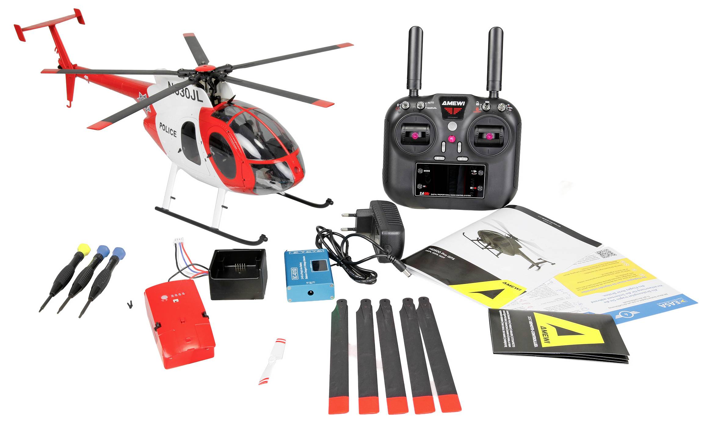 Spielzeug-Fernsteuerungshubschrauber mit Fernbedienung, Ersatzteilen, Batterien, Bedienungsanleitungen und Werkzeugen auf weißem Hintergrund.