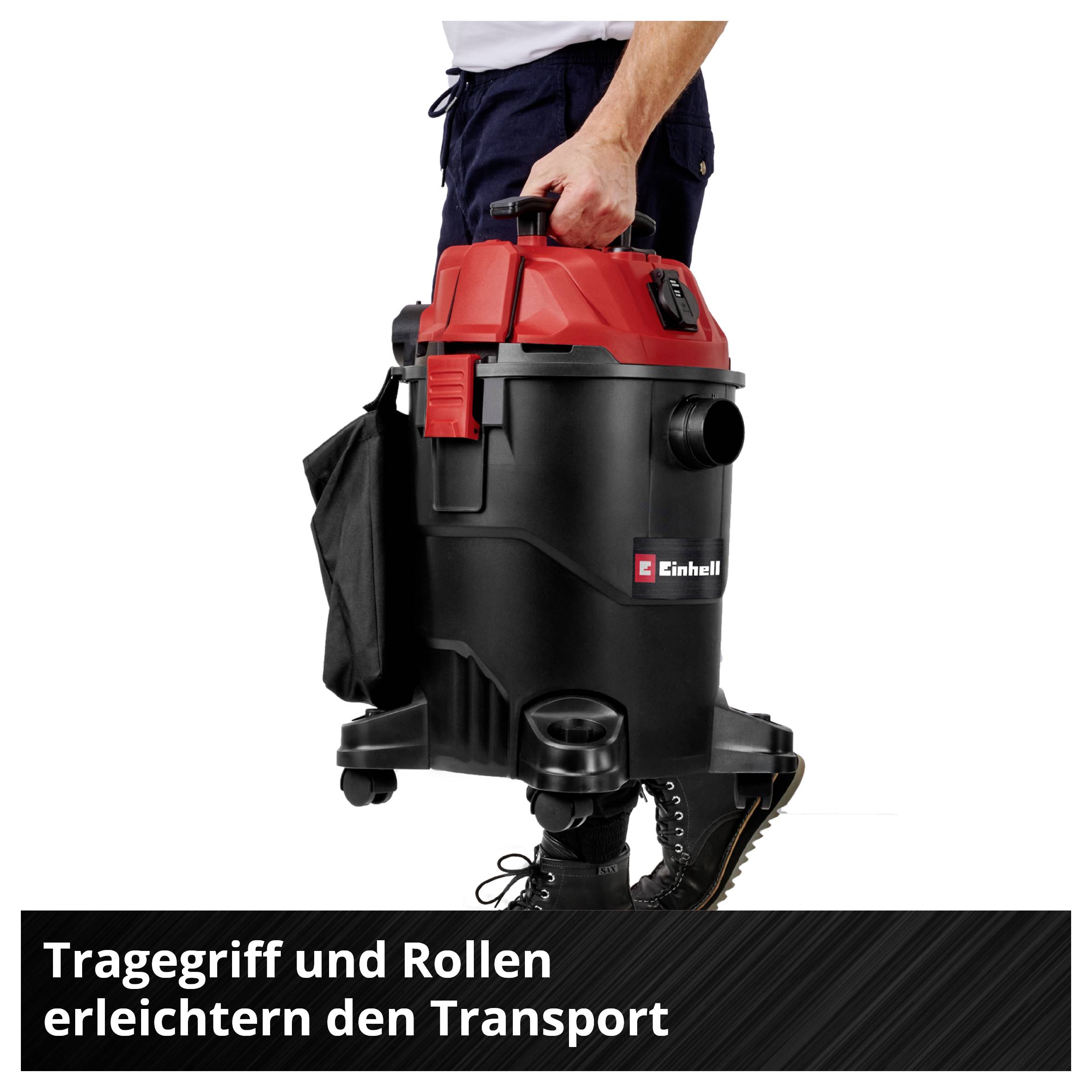 Einhand-Tragegriff und Rollen an einem schwarzen-roten Einhell-Gerät erleichtern den Transport; Text: 'Tragegriff und Rollen erleichtern den Transport'.