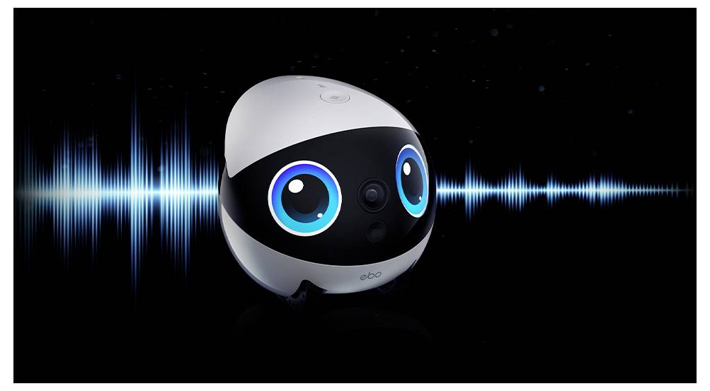 Ein kleines schwarz-weißes Robotergesicht mit leuchtend blauen Augen sitzt zentriert über einer blauen Audiowellenform auf schwarzem Hintergrund.