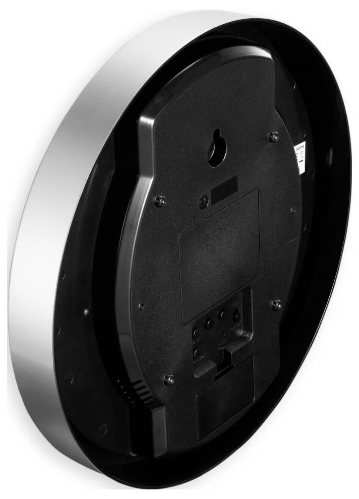 Runde schwarze Wanduhr von hinten gesehen, zeigt das Aufhängeloch, das Batteriefach und die Bedienungsschlitze.