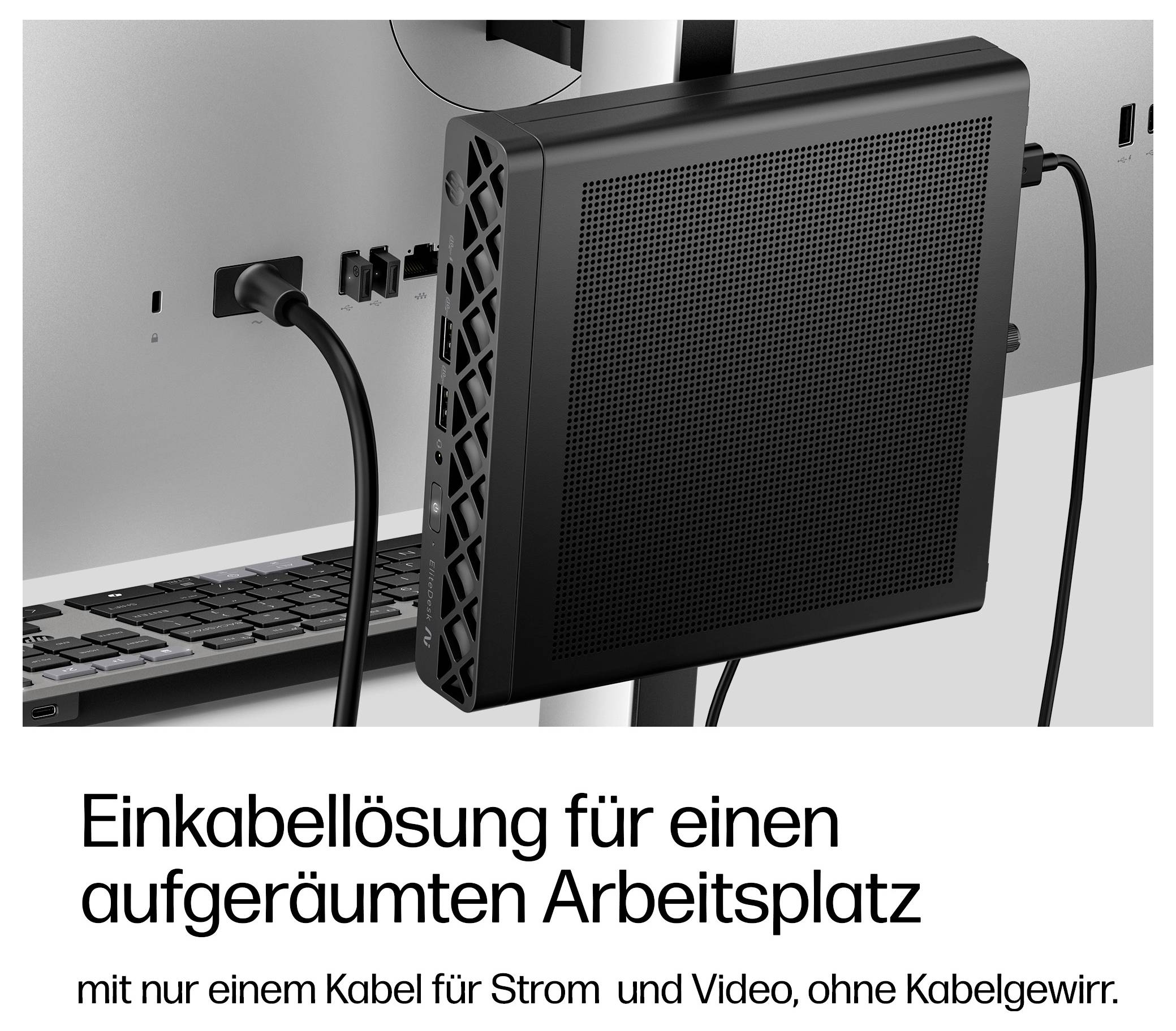 Kompaktcomputer hinter einem Monitor montiert, mit einem Kabel für Strom und Video; deutscher Text besagt „Single-Cable-Lösung für einen aufgeräumten Arbeitsplatz"
