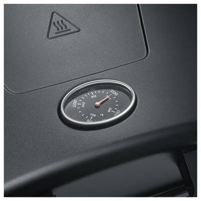 Nahaufnahme eines autoarmaturenbrett-ähnlichen Thermometers mit einer in Grad gekennzeichneten Skala, wobei sich die Nadel nahe bei 200 befindet und ein Wärmewarn-Symbol darüber angezeigt wird.